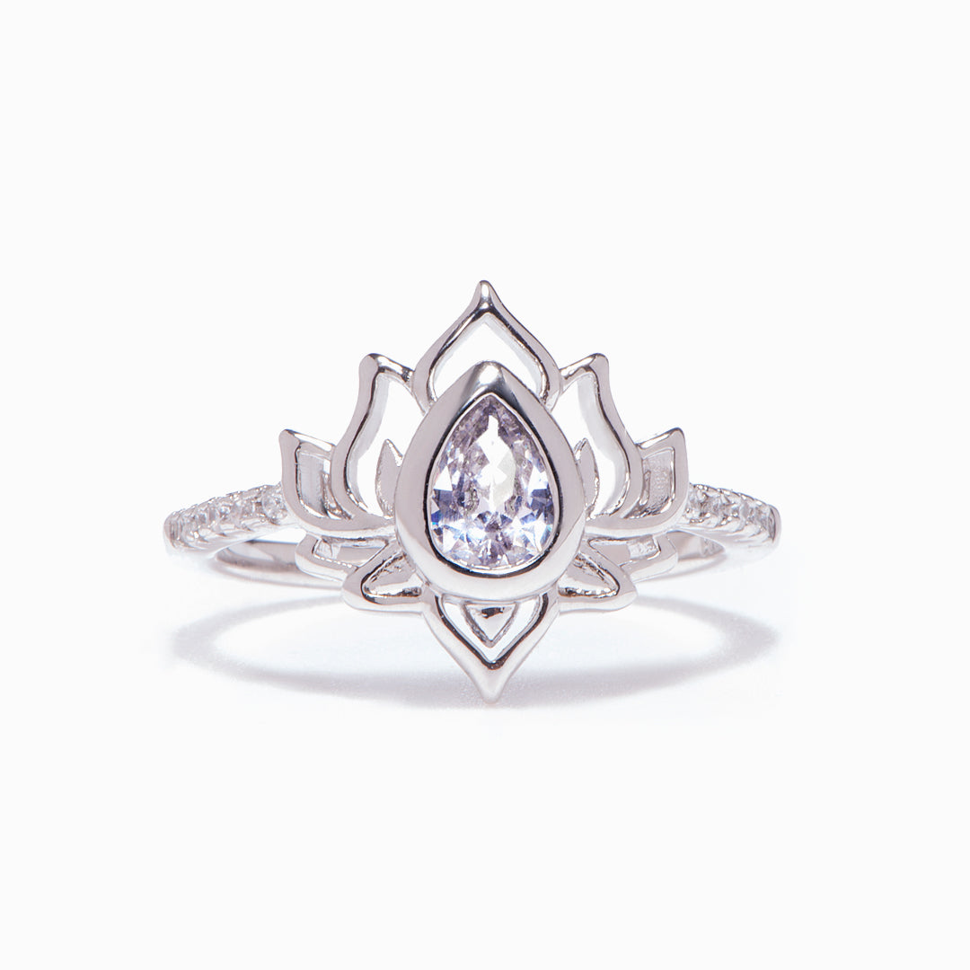 The image shows a silver ring with a lotus design, surrounded by a greeting card, a gift bouquet, a gift box, and a gift bag. The greeting card reads "GROW & BELIEVE Every day is a New Beginning take a deep breath and start again." The ring is part of the "Every day is a New Beginning" set, made of S925 sterling silver with a zircon stone. It is suitable for all ages.