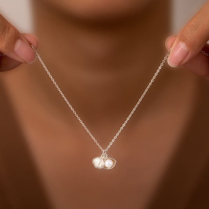 "Be persistent like the sand. It irritates the oyster that responds by becoming a stunning pearl." Necklace