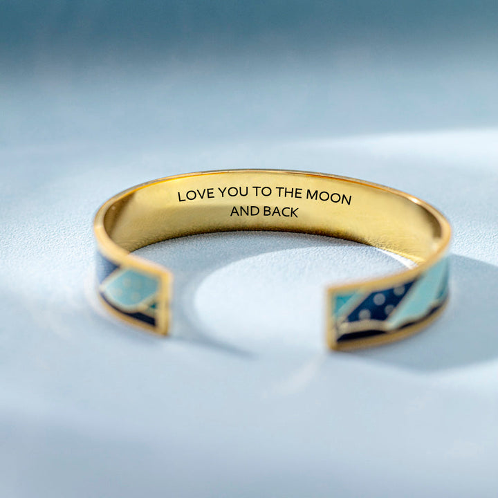 "I love you to the moon and back" titanium steel bracelet with engraved words and star designs. Show your granddaughter your endless love with this heartfelt gift set. Perfect for all ages with free shipping on orders over $50.