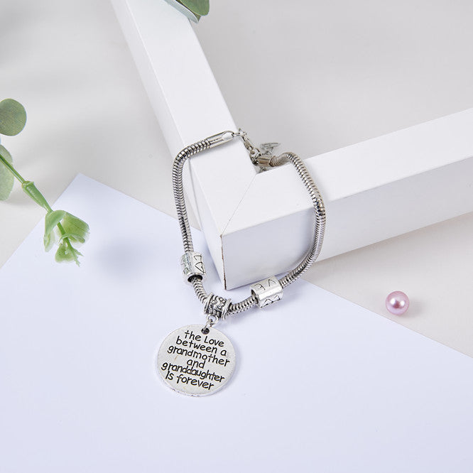 To My Granddaughter "the love between a grandmother and granddaughter is forever" Bracelet - SARAH'S WHISPER