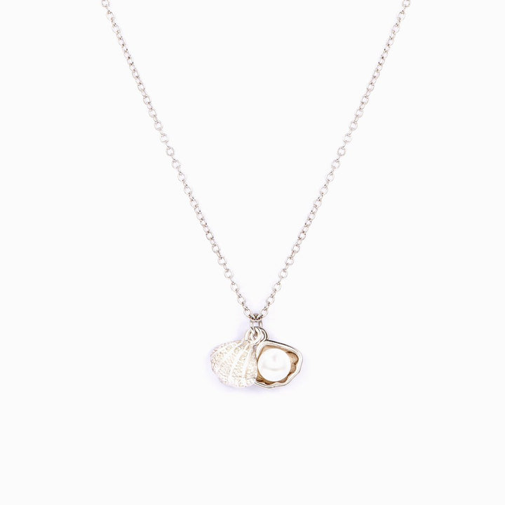 "Be persistent like the sand. It irritates the oyster that responds by becoming a stunning pearl." Necklace