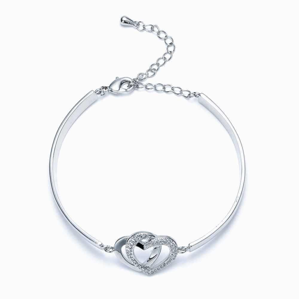 Design Interpretation: 'Forever Linked Together' Double Heart Bracelet - A meaningful copper bracelet featuring engraved words 'The love between grandmother granddaughter is forever' and two intertwined hearts, symbolizing an inseparable bond. Perfect for gifting to your granddaughter to remind her of your eternal connection.