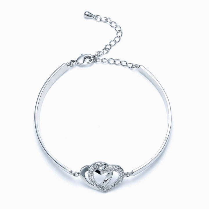 Design Interpretation: 'Forever Linked Together' Double Heart Bracelet - A meaningful copper bracelet featuring engraved words 'The love between grandmother granddaughter is forever' and two intertwined hearts, symbolizing an inseparable bond. Perfect for gifting to your granddaughter to remind her of your eternal connection.