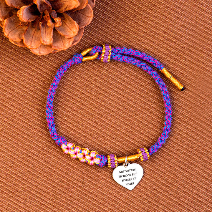 Braided bracelet with "Not Sisters by Blood but Sisters by Heart" design, crafted from cotton thread and titanium steel, ideal for best friends.