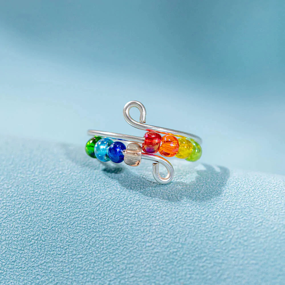 To My Daughter 'Drive Away Anxiety' Rainbow Ring - A stunning S925 sterling silver ring featuring several colored beads, designed to brighten your daughter's mood and alleviate anxiety. This thoughtful gift comes with an inspiring greeting card, a gift box, and a gift bag, serving as a reminder of a mother's love and protection. Suitable for all ages.