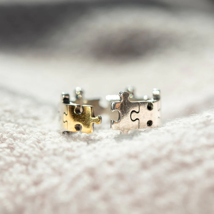 To My Daughter 'You Shine and Sparkle Differently' Puzzle Ring - A unique copper ring with a special gold-colored piece in the middle, symbolizing the distinctive and special nature of your daughter. This thoughtful gift comes with an inspiring greeting card, a gift box, and a gift bag, reminding her of her unique sparkle and individuality. Suitable for all ages