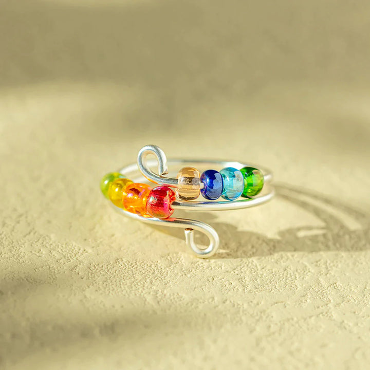 To My Daughter 'Drive Away Anxiety' Rainbow Ring - A stunning S925 sterling silver ring featuring several colored beads, designed to brighten your daughter's mood and alleviate anxiety. This thoughtful gift comes with an inspiring greeting card, a gift box, and a gift bag, serving as a reminder of a mother's love and protection. Suitable for all ages.