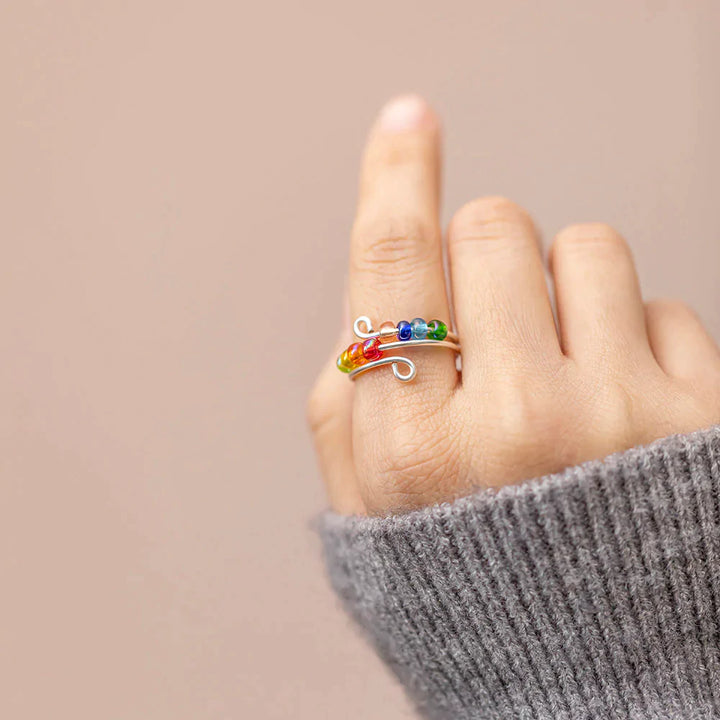 To My Daughter 'Drive Away Anxiety' Rainbow Ring - A stunning S925 sterling silver ring featuring several colored beads, designed to brighten your daughter's mood and alleviate anxiety. This thoughtful gift comes with an inspiring greeting card, a gift box, and a gift bag, serving as a reminder of a mother's love and protection. Suitable for all ages.