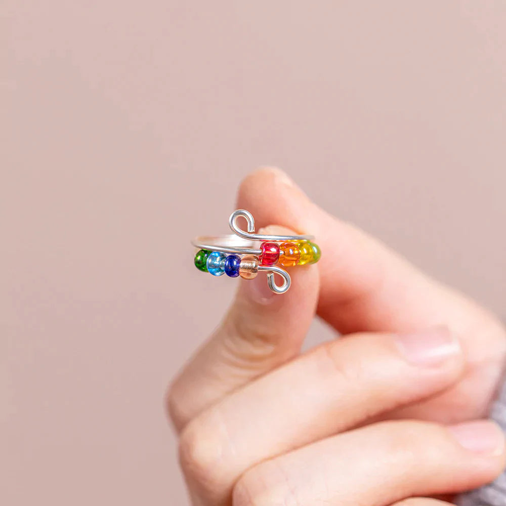 To My Daughter 'Drive Away Anxiety' Rainbow Ring - A stunning S925 sterling silver ring featuring several colored beads, designed to brighten your daughter's mood and alleviate anxiety. This thoughtful gift comes with an inspiring greeting card, a gift box, and a gift bag, serving as a reminder of a mother's love and protection. Suitable for all ages.