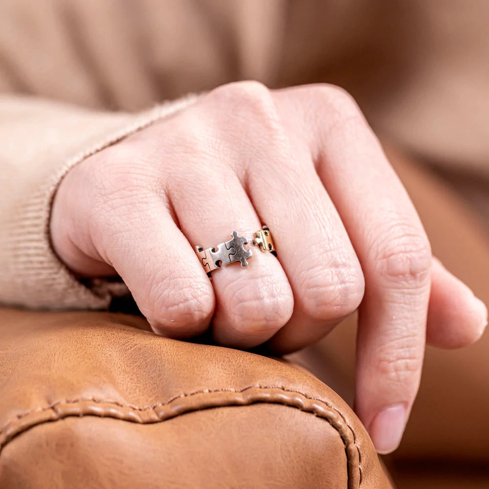 To My Daughter 'You Shine and Sparkle Differently' Puzzle Ring - A unique copper ring with a special gold-colored piece in the middle, symbolizing the distinctive and special nature of your daughter. This thoughtful gift comes with an inspiring greeting card, a gift box, and a gift bag, reminding her of her unique sparkle and individuality. Suitable for all ages