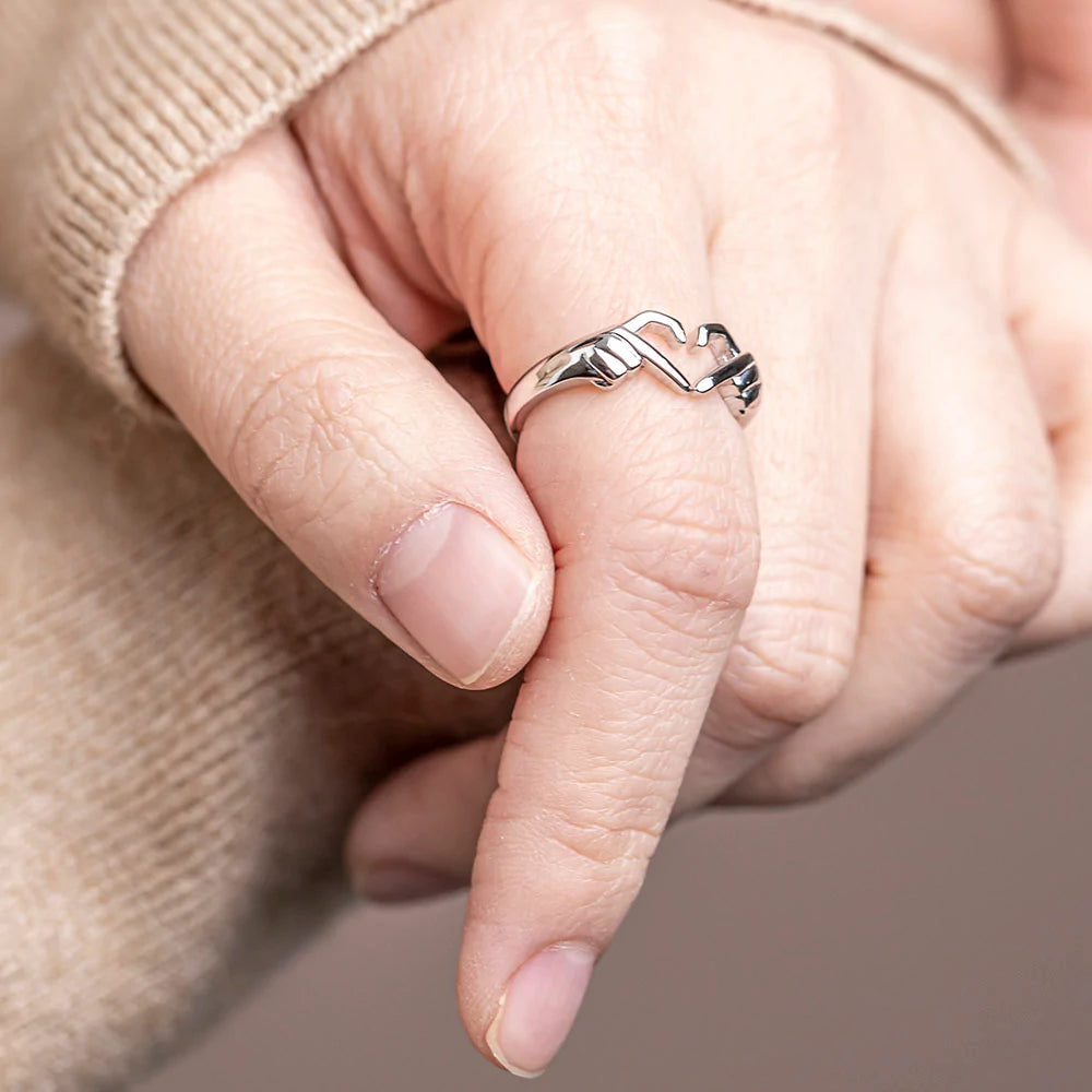 Heart gesture hand ring with intricate design, perfect for daughters of all ages. Alloy material with plating for durability and elegance. Complete gift package with ring, card, gift box, and bag. A meaningful gift to express eternal love and adoration.