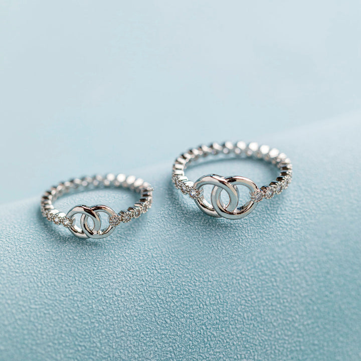 Pictured are two paired [Parent-Child Set] To My Granddaughter 'Forever linked together' Interlocking Ring in S925 sterling silver, symbolizing the unbreakable bond between grandmother and granddaughter.