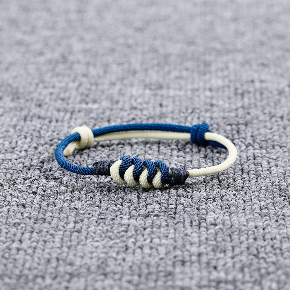 Blue cotton rope knot bracelet with an inspiring message card in a gift box.