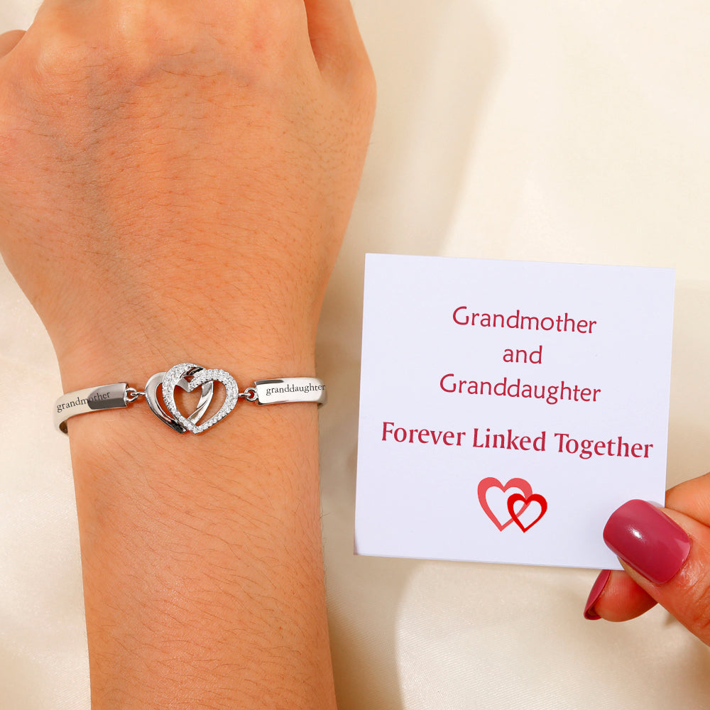 Design Interpretation: 'Forever Linked Together' Double Heart Bracelet - A meaningful copper bracelet featuring engraved words 'The love between grandmother granddaughter is forever' and two intertwined hearts, symbolizing an inseparable bond. Perfect for gifting to your granddaughter to remind her of your eternal connection.