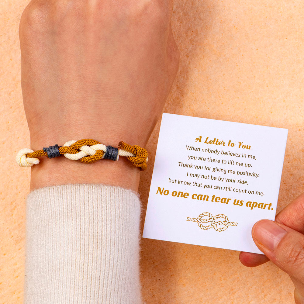 Unbreakable knot bracelet made from cotton rope, accompanied by a greeting card, gift box, and gift bag, symbolizing everlasting friendship and loyalty.