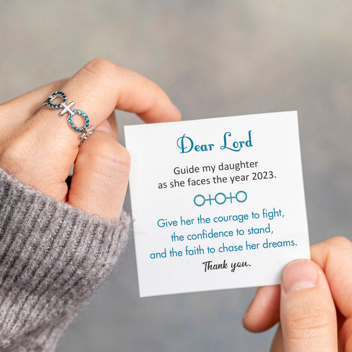 Cross ring with sentimental message, ideal for guiding your daughter through the year. The image showcases a beautifully crafted ring adorned with a cross motif, symbolizing faith and guidance