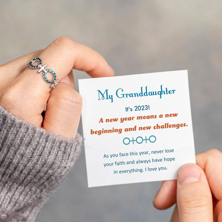 Cross ring with a message of hope for the new year, perfect for your granddaughter's journey in 2023. The image showcases a beautifully designed ring adorned with a cross motif, symbolizing guidance and strength.