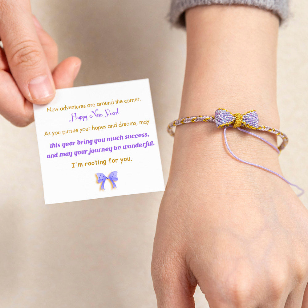 Knitted bowknot bracelet with an inspirational message. Perfect for wishing luck and support. The image depicts a stylish bracelet adorned with a bowknot, symbolizing encouragement and well-wishes for the wearer's journey