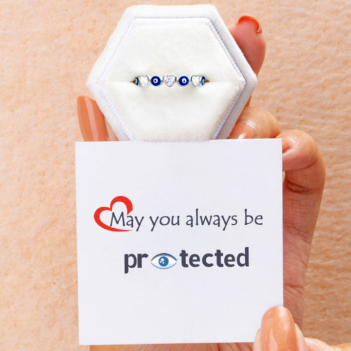 Pictured is the 'Always be protected' ring in S925 sterling silver, placed in a Sarah Whisper store box along with a greeting card.