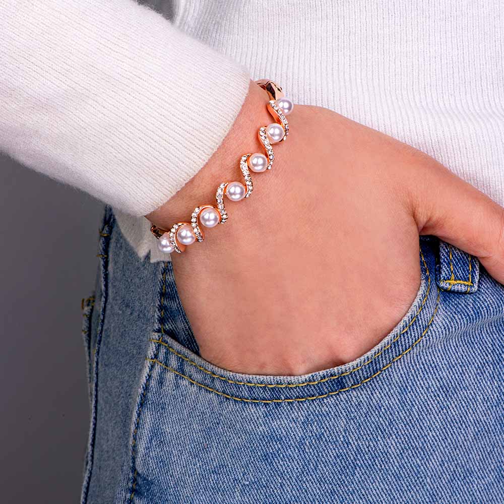 Elegant wavy pearl bracelet with an inspirational message card in a gift box.