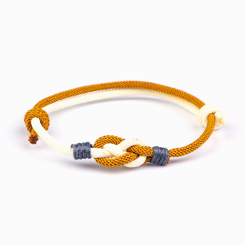 Unbreakable knot bracelet made from cotton rope, accompanied by a greeting card, gift box, and gift bag, symbolizing everlasting friendship and loyalty.