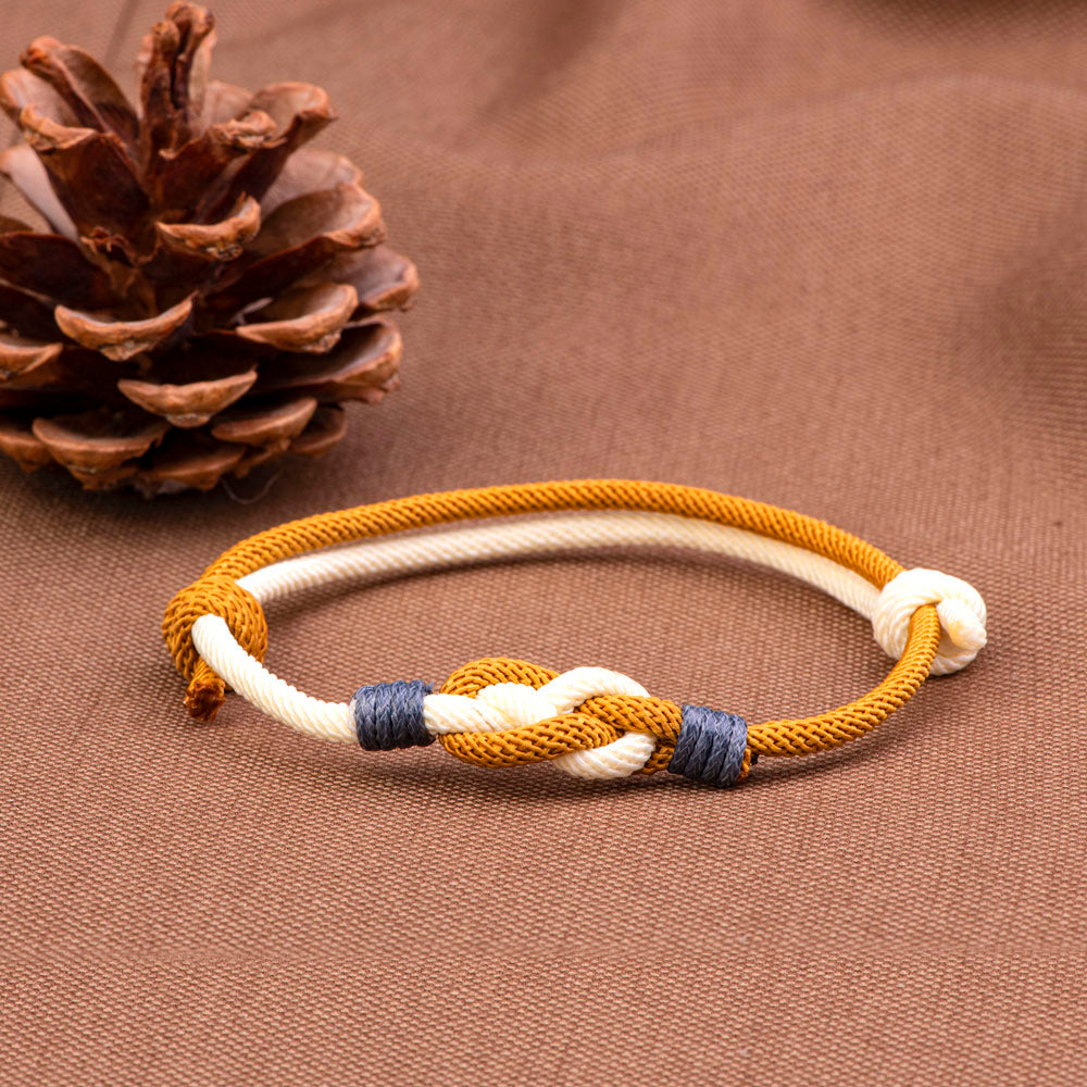 Unbreakable knot bracelet made from cotton rope, accompanied by a greeting card, gift box, and gift bag, symbolizing everlasting friendship and loyalty.