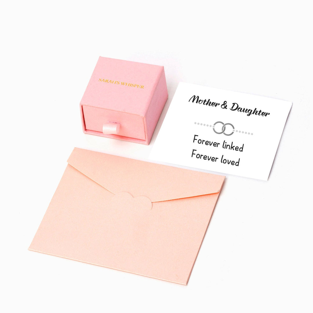 Pictured are a gift box, greeting card and gift envelope.