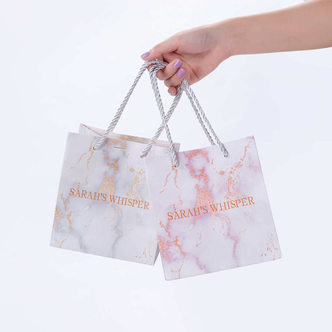 Sarah Whisper gift wrap. A gift bag, a bag