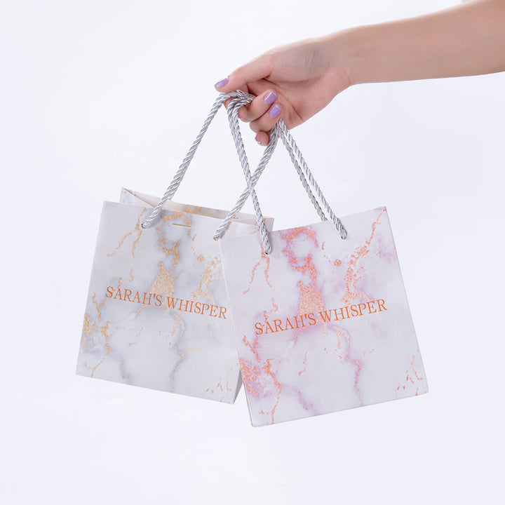 Sarah Whisper gift wrap. A gift bag, a bag